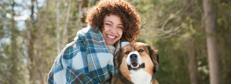 Young smiling woman with dog